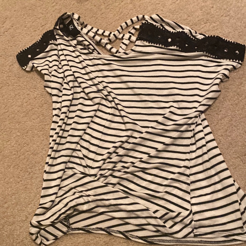 Striped shirt that’s black and white.